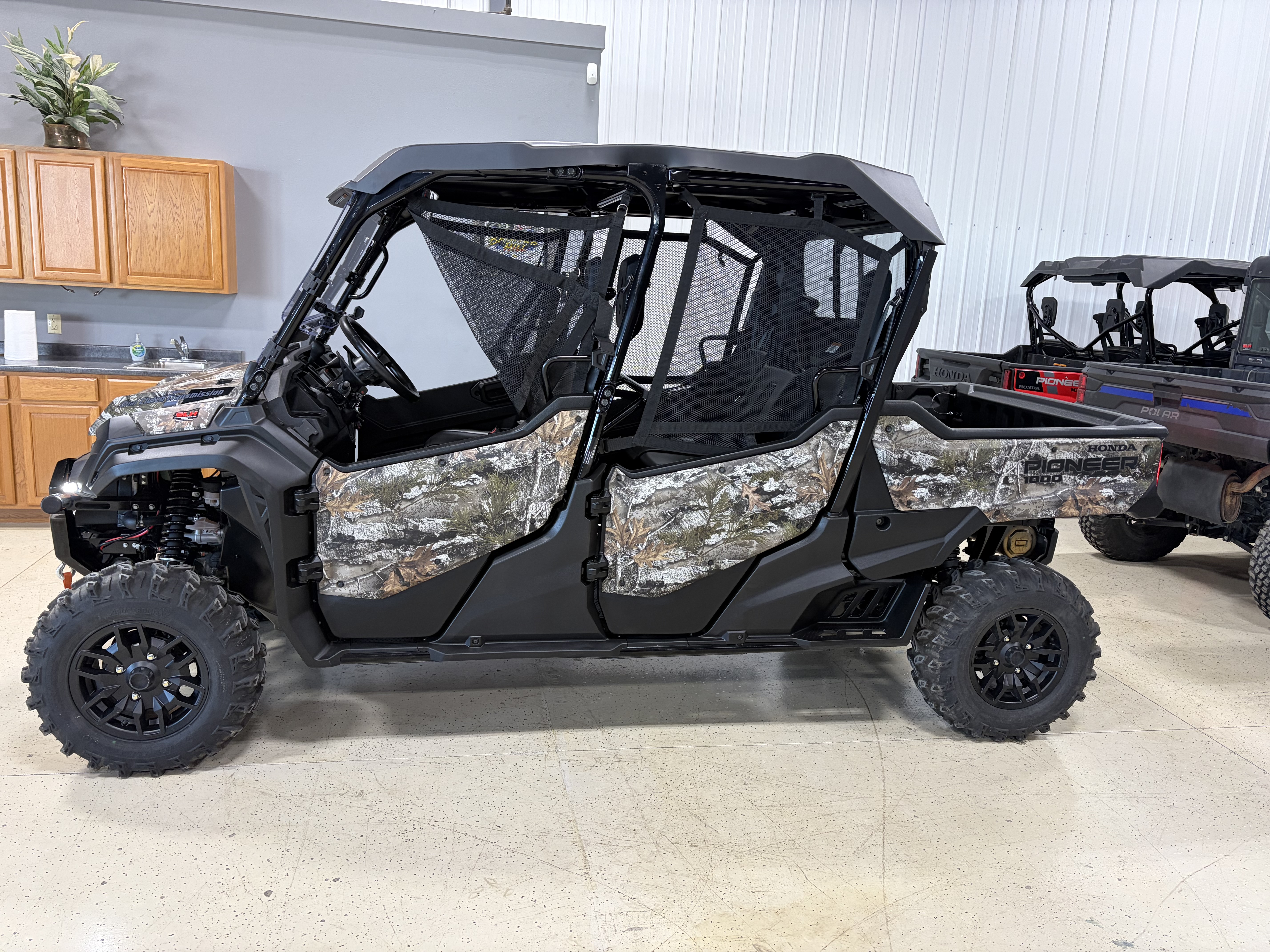 2025 Honda® Pioneer 1000-6 Deluxe Crew Truetimber Atera Camo Side x Side
